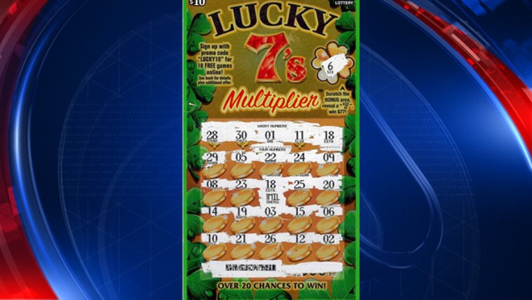 woman wins million in lucky 7s_1504016994201.jpg