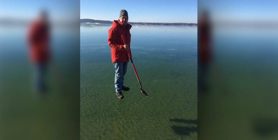 WALKING ON WATER: Remarkably clear ice Up North makes man look like he's floating on Lake Charlevoix