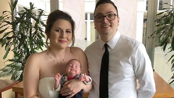 Bride carries her premature baby down the aisle at hospital wedding