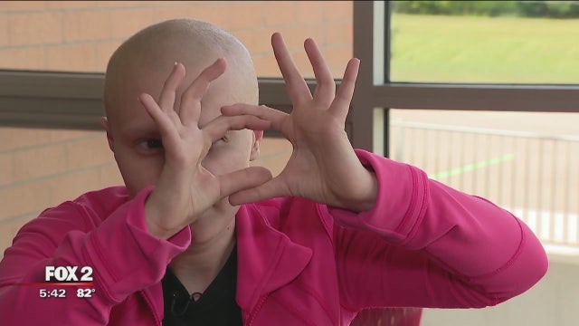 After brain cancer diagnosis, college student completes school in hospital. She's now cancer free