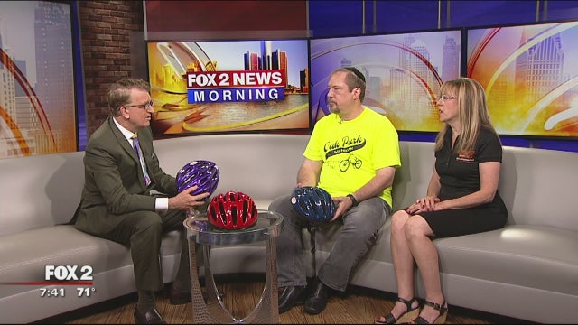 Oak Park E-Z Roll Handing Out Bike Helmets