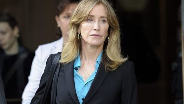 ce026d42-Actress Felicity Huffman sentenced to 14 days in prison in college admissions scandal