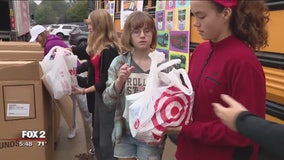 Seaholm High School fills the bus with canned food for Gleaners