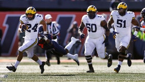 Michigan needs late surge to hold off Illinois 42-25