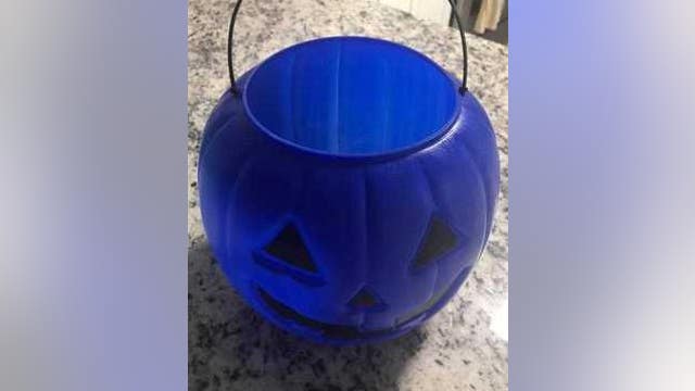 Raising autism awareness with blue Halloween buckets