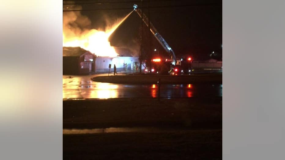 Firefighters battle a fire at Warren's Chicago Deli