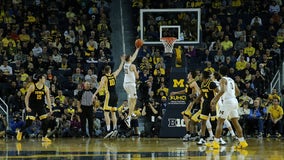 No. 4 Michigan tops Iowa 103-91