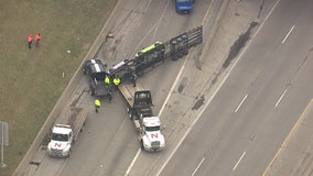 Car transporter flips on I-75 at Gratiot, all northbound lanes blocked