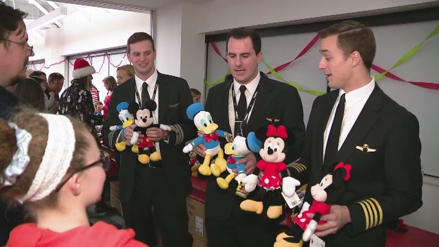 Kids get break from therapy at Beaumont holiday party with airline pilots