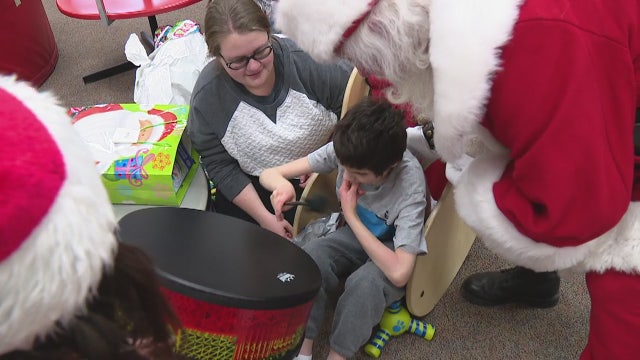 Santa dropped by a nonprofit that assists blind and handicapped kids Friday. And he brought presents
