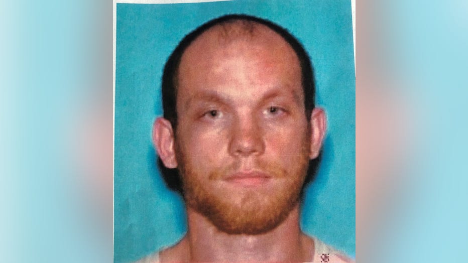 A driver's license photo of 22-year-old suspect, Devin Cronk.