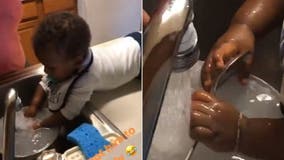 Grandmother has baby 'doing dishes' in hilarious viral video: 'He loves water'