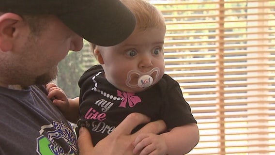 Baby's eyes open wide after meeting man who donated part of his liver