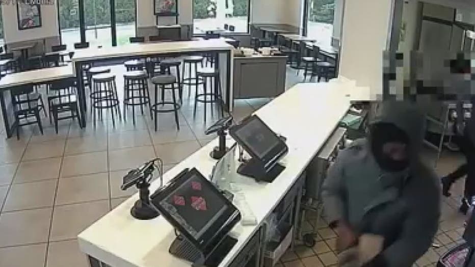 Surveillance video showing a suspect inside a Taco Bell restaurant