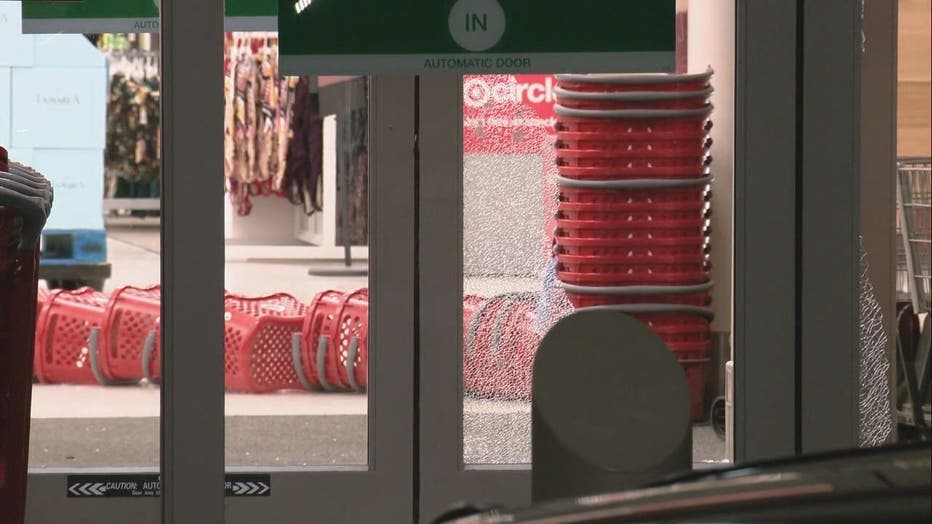 Smashed glass at the entry door of a Target