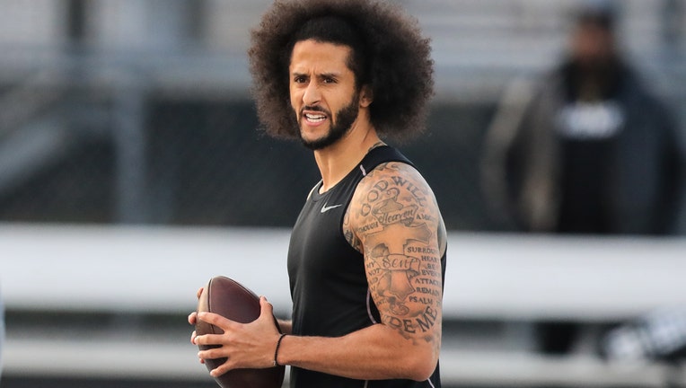RIVERDALE, GA - NOVEMBER 16: Colin Kaepernick looks to make a pass during a private NFL workout held at Charles R Drew high school on November 16, 2019 in Riverdale, Georgia. Due to disagreements between Kaepernick and the NFL the location of the workout was abruptly changed. (Photo by Carmen Mandato/Getty Images)