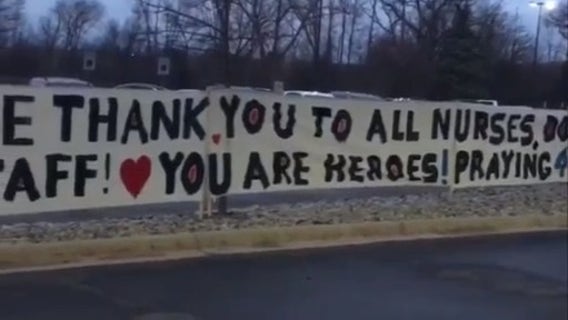 Family posts 45-foot thank you sign outside for Beaumont Troy ICU staff