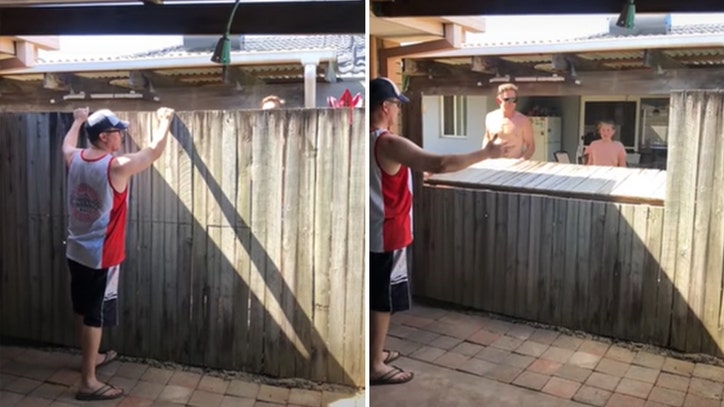 Neighbors use fence to create makeshift bar counter amid coronavirus ...