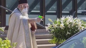 Internet has blast with Grosse Pointe priest's holy water squirt gun for social distance Easter blessings