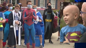 Boy battling cancer gets superhero surprise visit from Catholic Central wrestlers