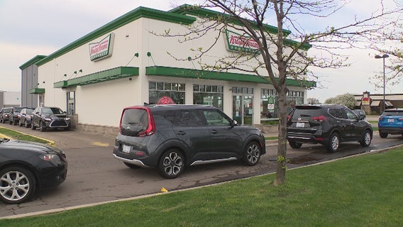 Graduates line up for hours at Krispy Kreme in Troy for donut giveaway