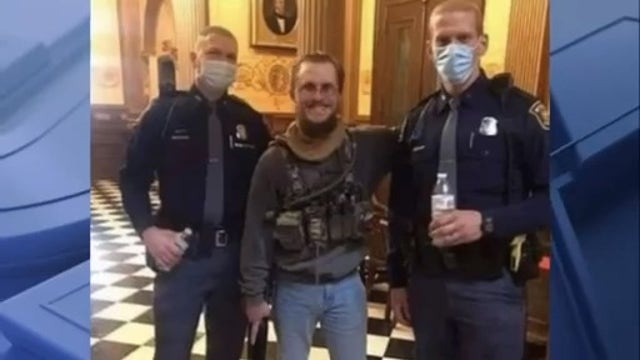 Detroit NAACP outraged at state police photo with armed demonstrator at Capitol