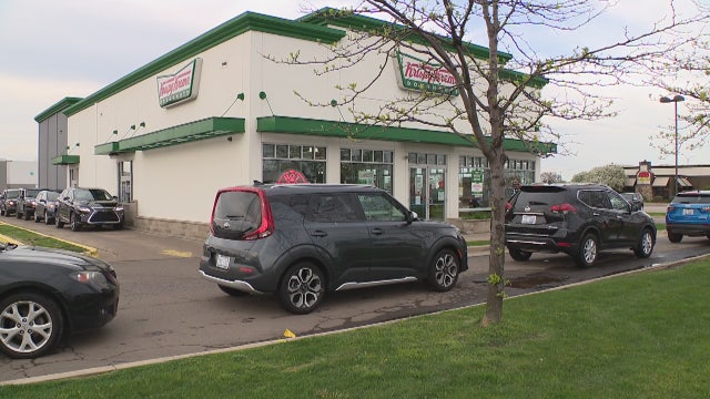 Graduates line up for hours at Krispy Kreme in Troy for donut giveaway