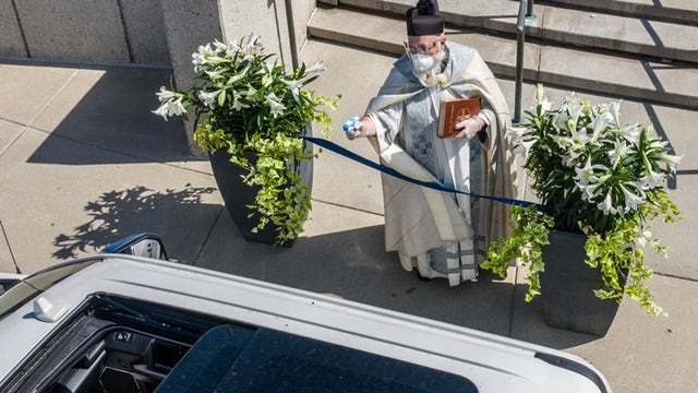 Michigan priest draws squirt gun in fight against coronavirus