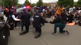 Peaceful demonstration nearly marred by driver trying to run down protester in Troy