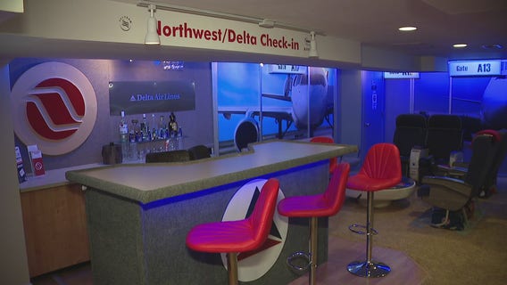 Livonia flight attendant turns love for flying into replica airport terminal in his basement