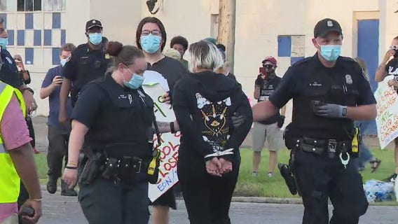 Arrests made, car towed as protests over Detroit schools reopening continue