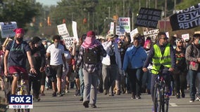 Protesters gather to support Warren family after their home was vandalized 