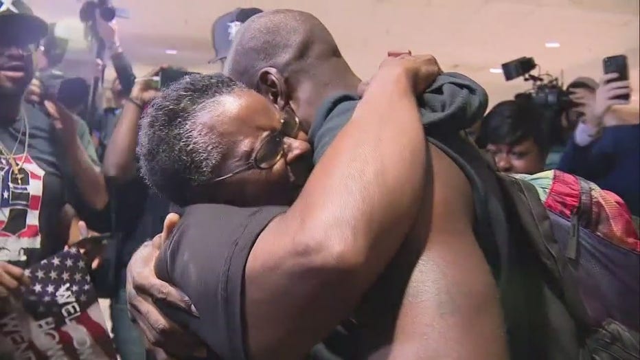 Wendell Brown hugs his mother after arriving at Metro Airport in 2019.