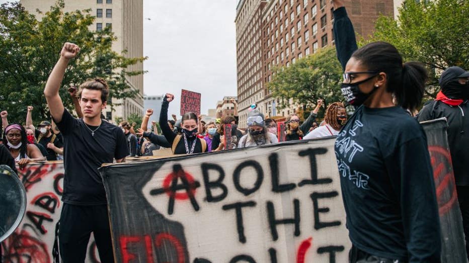 LOUISVILLE, KY - SEPTEMBER 23: Demonstrators march in the street following the Grand Jury verdict on September 23, 2020 in Louisville, Kentucky. Protesters marched in the streets after the Kentucky Grand Jury verdict indicts 1 of 3 officers involved in the killing of Breonna Taylor, who was fatally shot by Louisville Metro Police officers during a no-knock warrant at her apartment on March 13, 2020 in Louisville, Kentucky. (Photo by Brandon Bell/Getty Images)