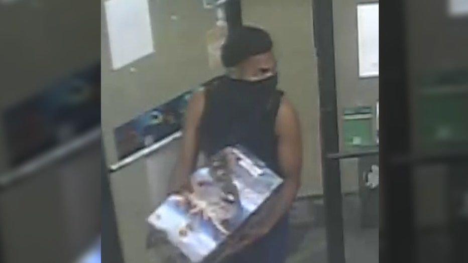 Suspect wanted for setting fireworks off inside Detroit gas station.