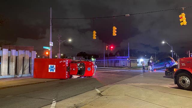 Ambulance flips after being hit while taking patient to hospital in Detroit