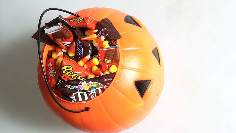 A child's bucket of Halloween candy