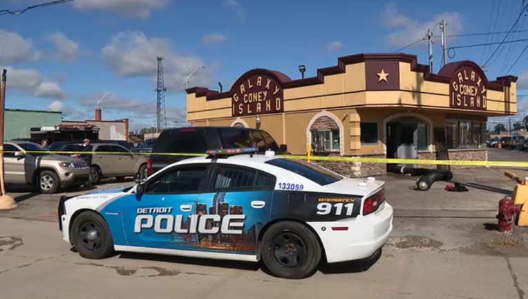 A Detroit police vehicle sits outside the Galaxy Coney Island, which has been taped off with crime tape.