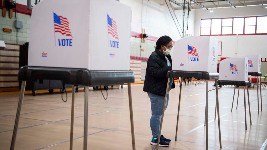 A voter fills out a ballot at Edmondson High School in Baltimore, Md., on April 28, 2020. (Photo By Tom Williams/CQ-Roll Call, Inc via Getty Images)