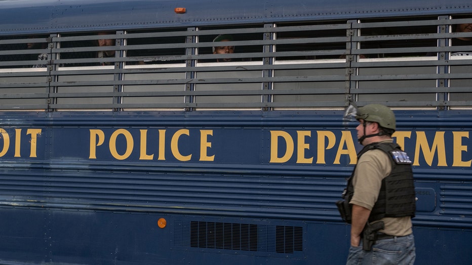 Non-violent protest organizers of 'Detroit Will Breath' were detained by Detroit police during a march against police brutality near Detroit's west side, where 20-year-old Hakeem Littleton was shot and killed by Detroit Police earlier in the day Friday, July 10, 2020. (Photo by SETH HERALD/AFP via Getty Images)