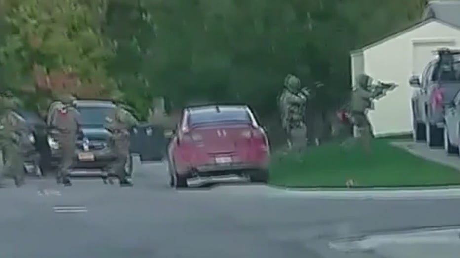 A raid at a suspected militia member's residence in Hartland Wednesday. Still photo from video by: Austin Burnett via TMX.news. 