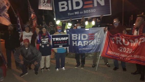 Michigan harmony: Trump and Biden supporters pause to sing 'God Bless America'