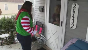 Teacher makes special deliveries to students with gifts, care packages