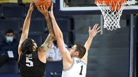 Brown scores 18, Michigan uses big 2nd-half run to beat UCF