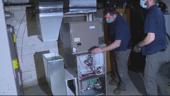 Retired Warren firefighter donates new furnace to single mother