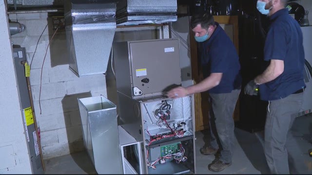 Retired Warren firefighter donates new furnace to single mother