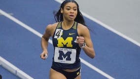 U-M freshman track standout wins stunning comeback relay - and video goes viral