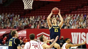 Back from layoff, No. 3 Michigan tops No. 21 Wisconsin 67-59