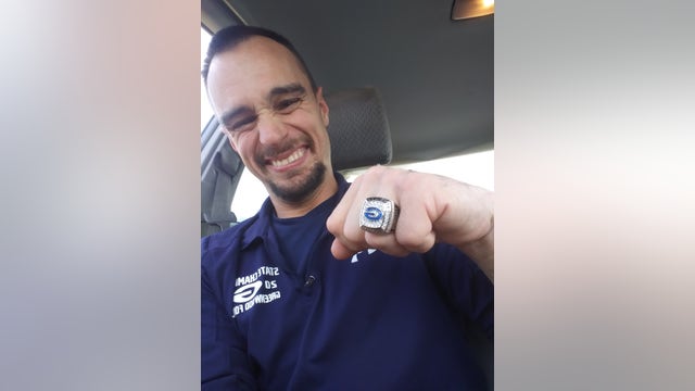 High school football team awards disabled janitor with championship ring