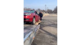 WATCH: Southfield tow truck driver frees deer pinned by car